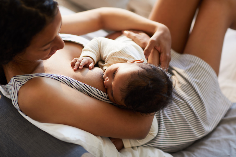 breastfeeding mother with baby