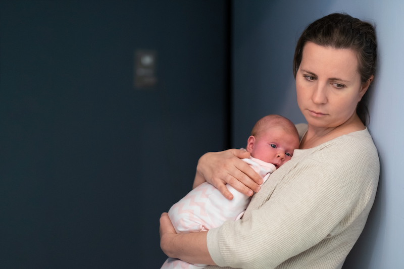 mother with baby suffering